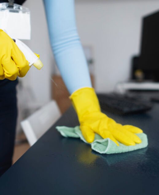 person-taking-care-office-cleaning